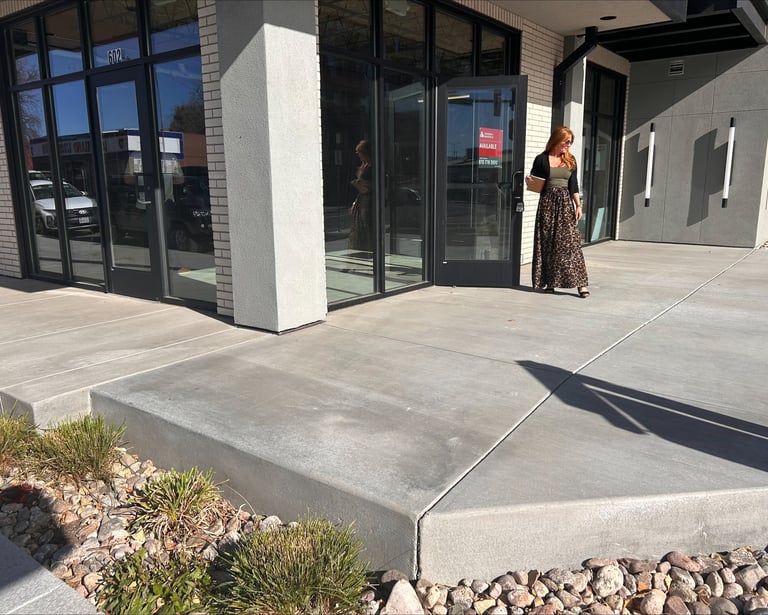 Owner Mindy Bryant standing in front of the new Loveland Edge Optics location
