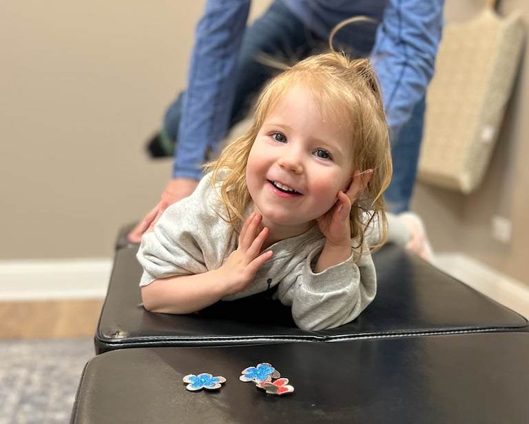 Happy child after adjustments is now calmer and happier without stress on her nervous system