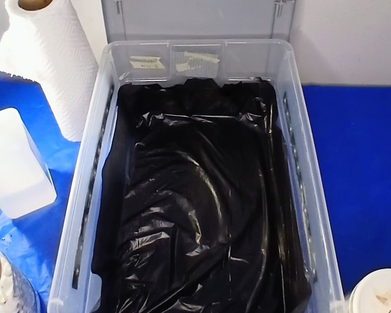 a tubbed lined with a black liner to prevent side pins in mushroom cultivation