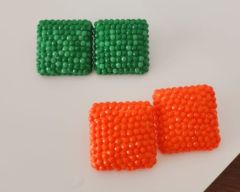 two pieces of beads on a white surface