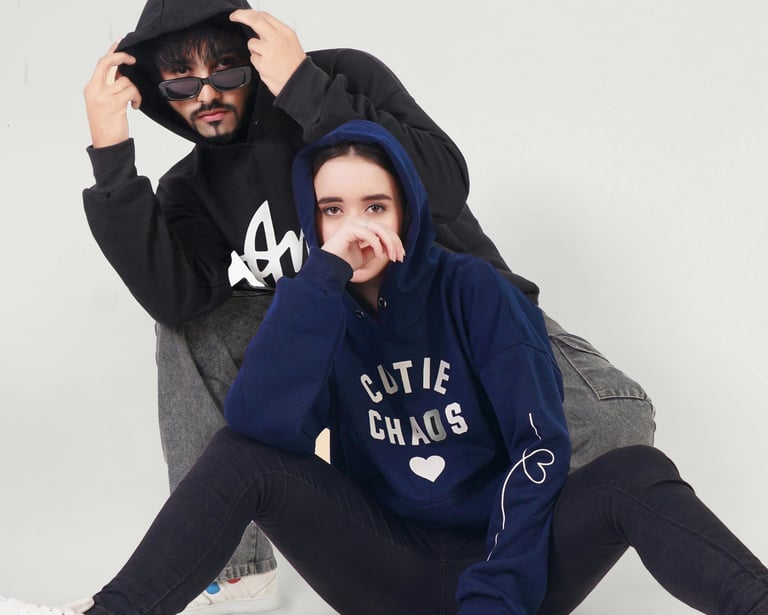 2 people wearing customized hoodies