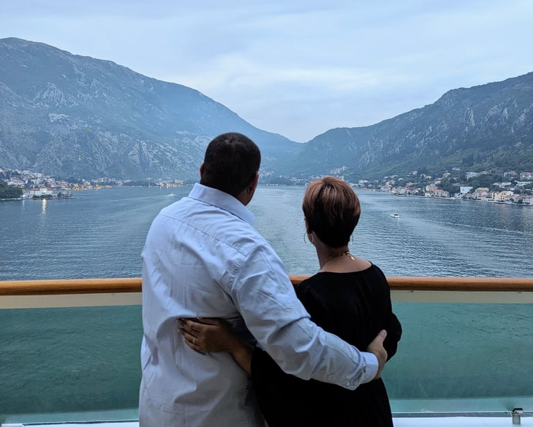 My wife and I on the back of a boat in the bay of Kotar, Montenegro