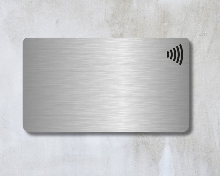 a metal NFC card with a wireless logo on top. made in paranaque