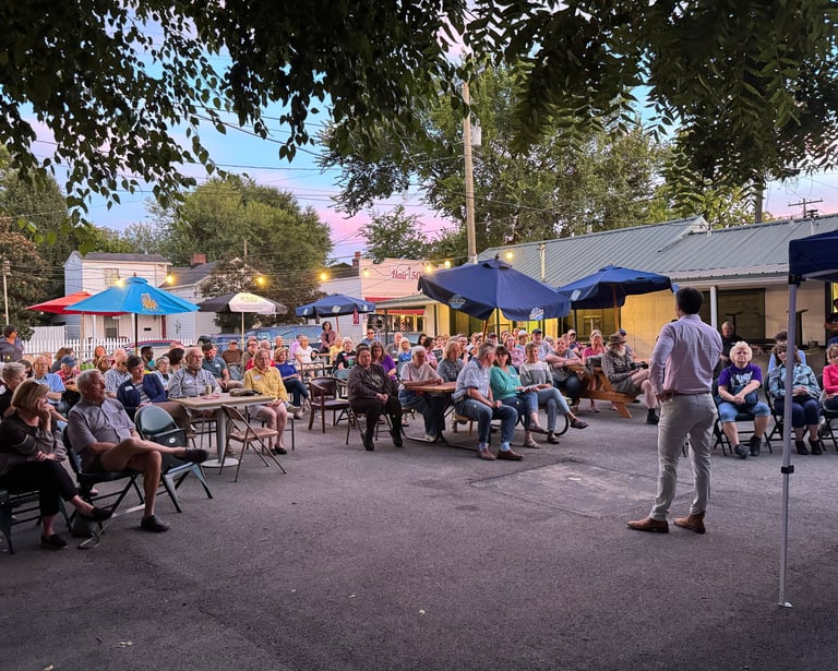 a man standing in front of a crowd of people