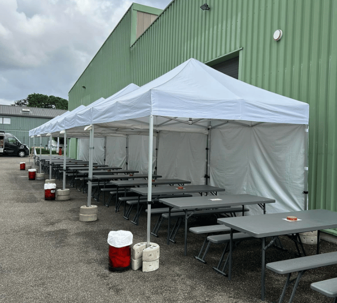 a group of tables and chairs in a parking lot
