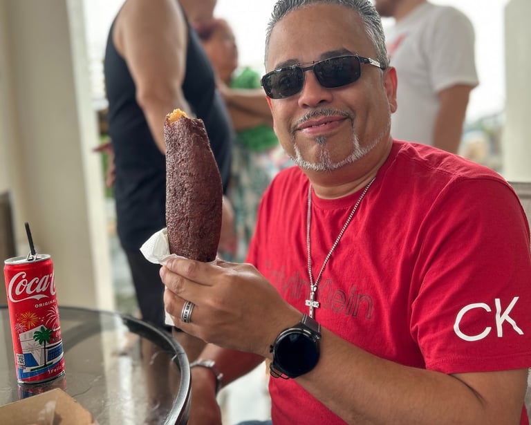 a man eating an puerto rican alcapuria