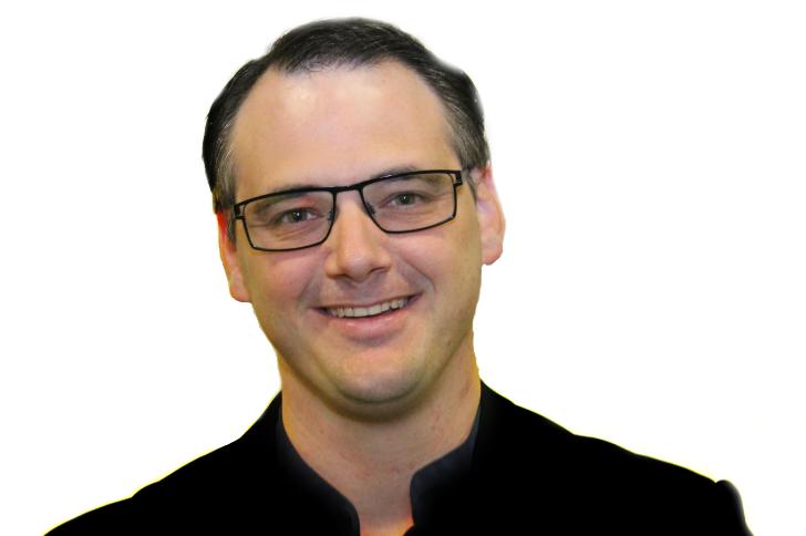 a man in a black shirt and glasses
