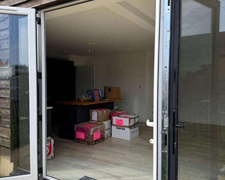 storage boxes stacked up in a house in worcester