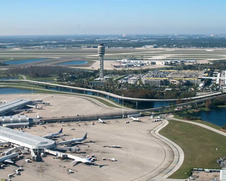 a large airport with a lot of airplanes and planes