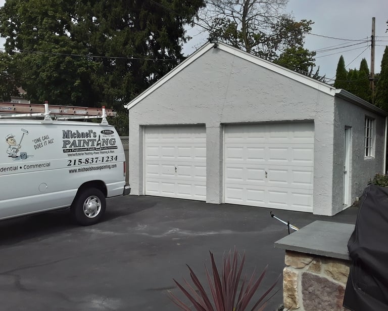 a van in the driveway and a garage