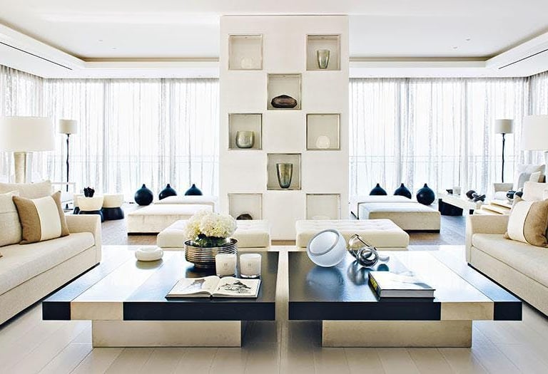 a living room with a couch and a table Nour Nagy Designs London interior Design