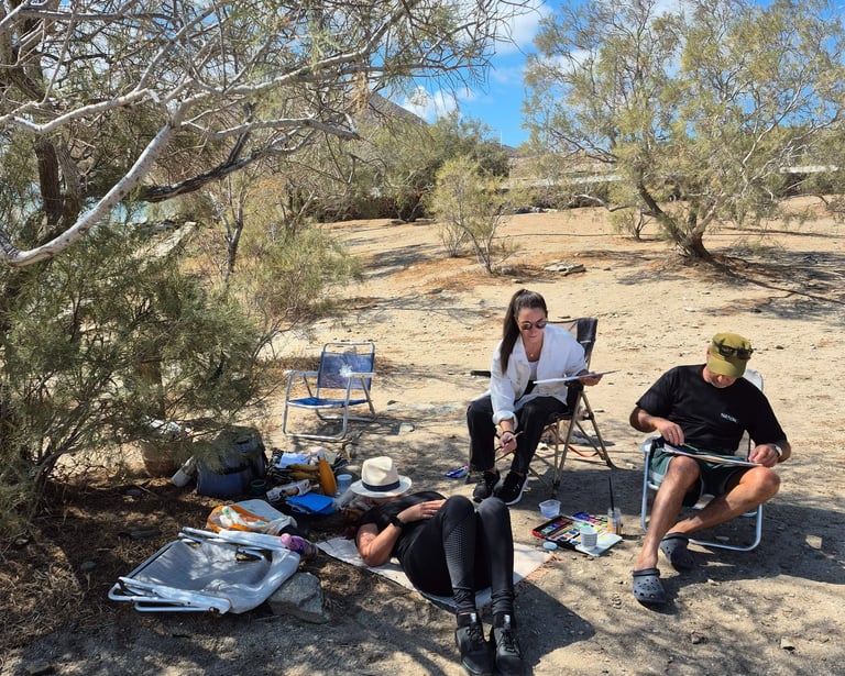 a group of people painting under the trees