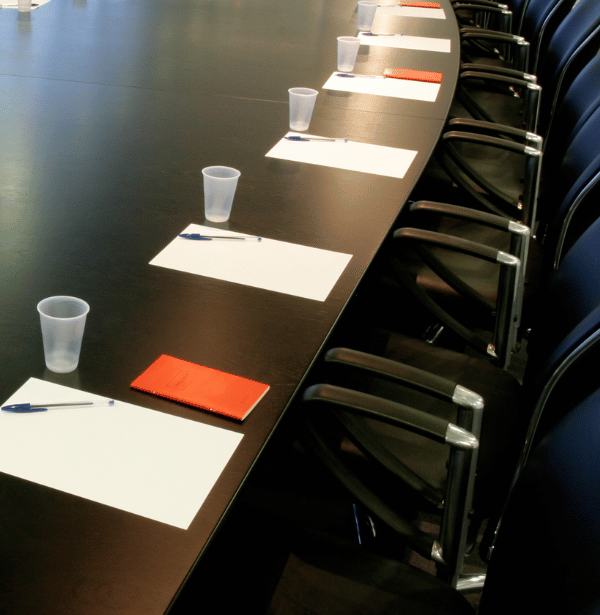 Corporate boardroom table setup for strategic governance meetings