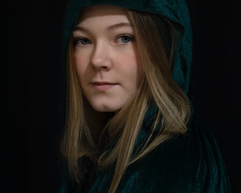 Film production company: woman in a green robe and black jacket