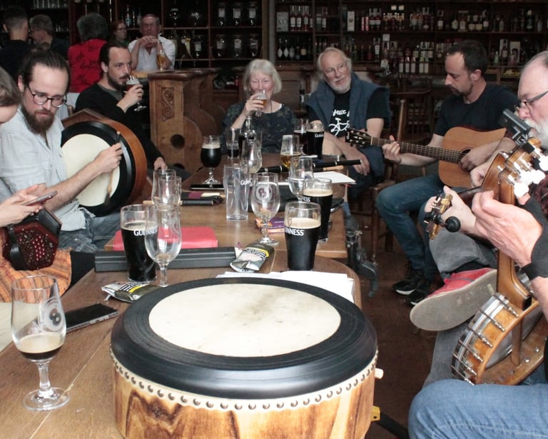 Musicians playing traditional folk music instruments during a lively session at an Irish pub.