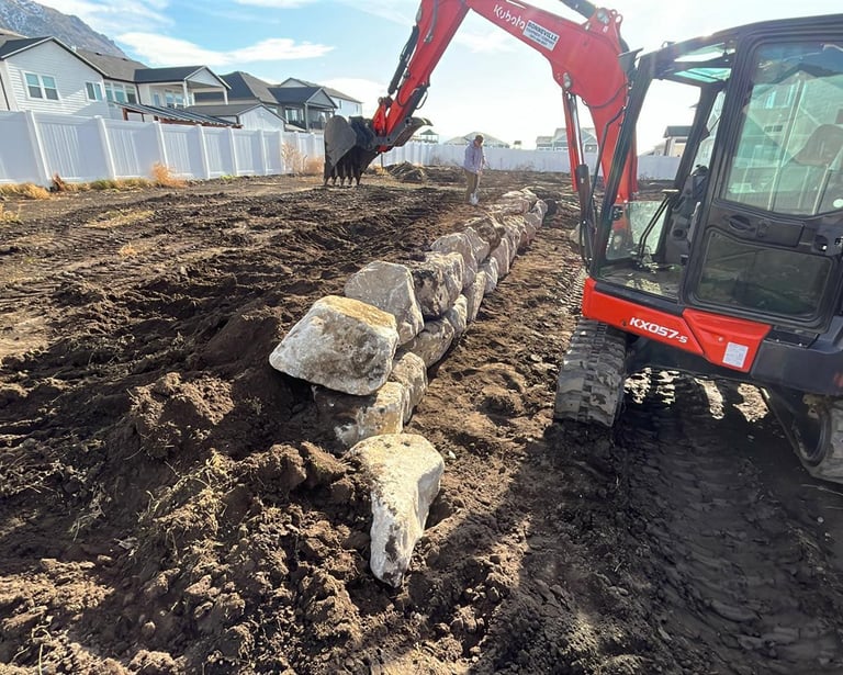 Kubota KX057-s excavator building rock boulder wall