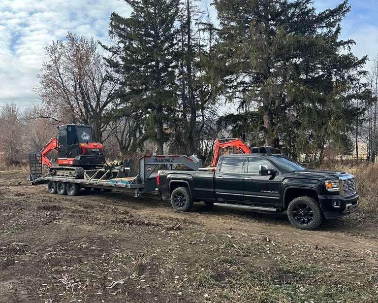 JMB Earthwork's truck and trailer hauling equipment