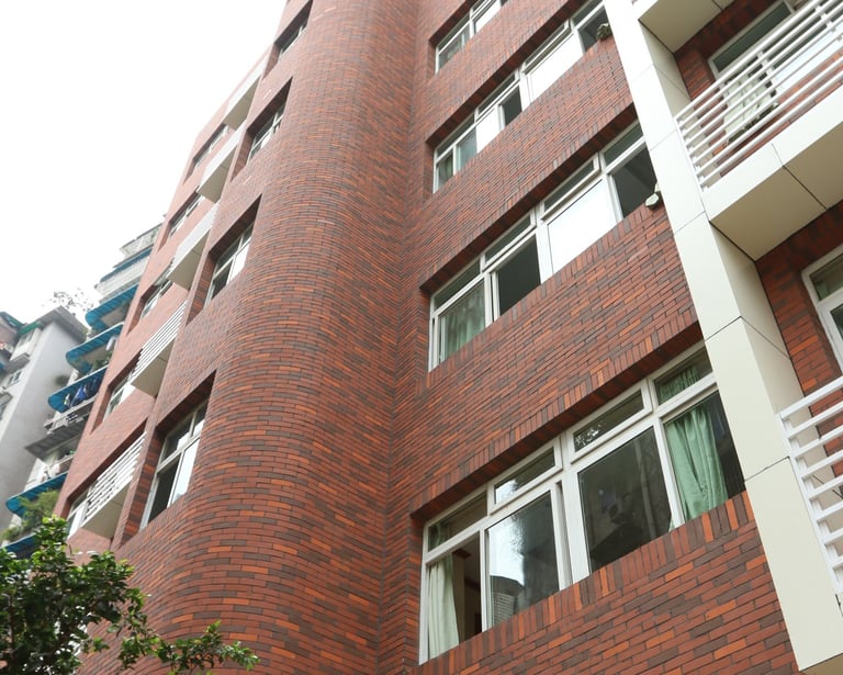 Bestone Materials flexible facing brick installation, red textured MCM brick veneer on exterior wall
