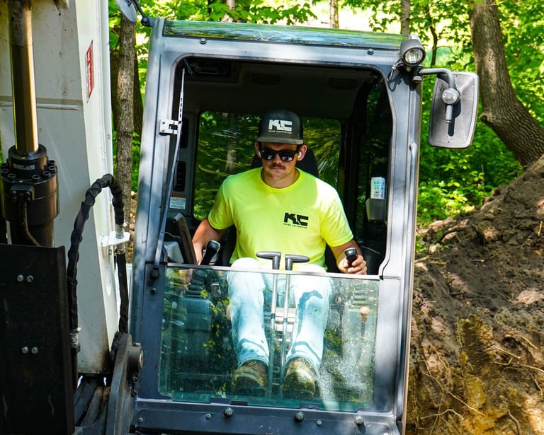 Patrick Kruse, Owner of Kruse Contracting, digging in an excavator