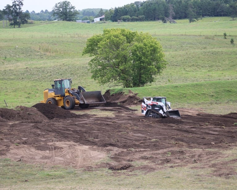 skid steer moving dirt