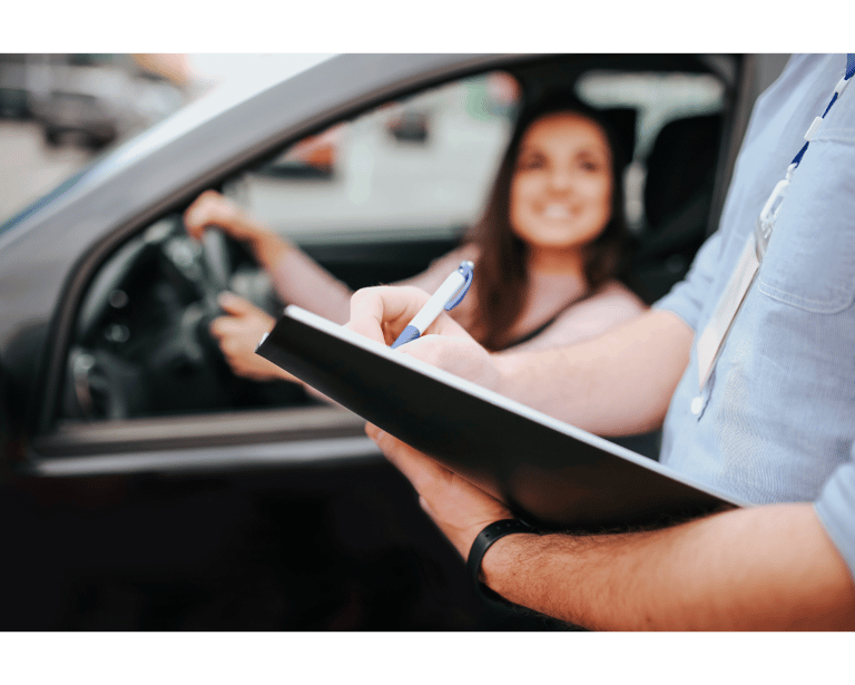a women Lerner student is getting instructions from instructor before defensive driving course.  