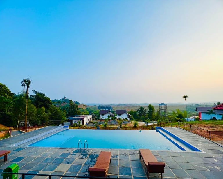 A family enjoying the amenities at Karapuzha Resorts, with children playing in a secure playground a
