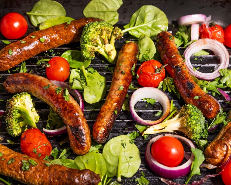 Sustainable plant-based, nutritionally-dense, hypoallergenic protein and fibre sausages with vegetables surrounding