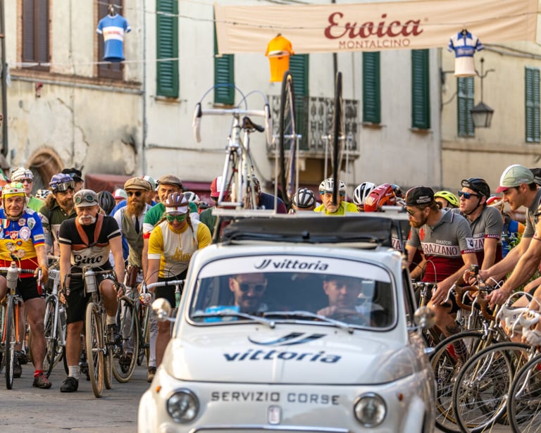 a group of people riding bikes in front of a car
