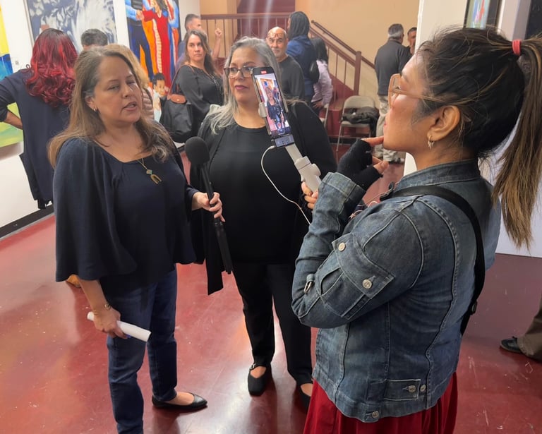 Nonprofit client is interviewed at Art Exhibit after media training