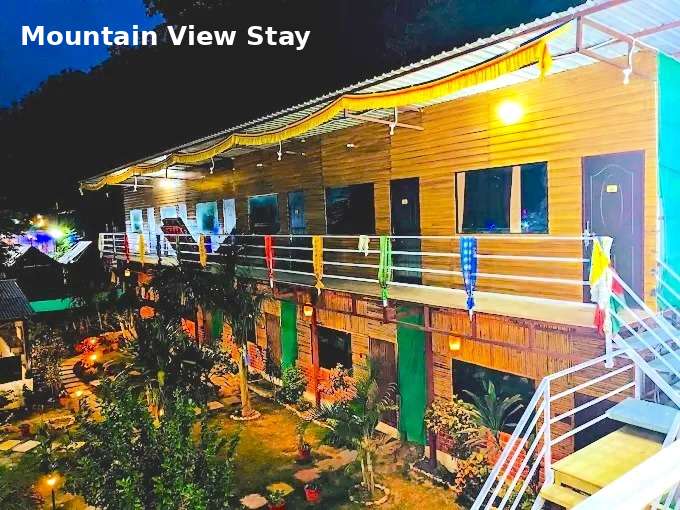 Jungle Lore Resort with mountain view rooms and beautiful night lighting