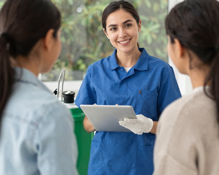 Technician treating perimeter of a home