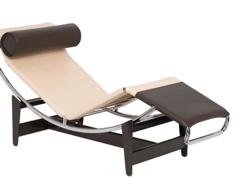 Modern chaise longue with curved metal frame and leather details inspired by Charlotte Perriand’s fu
