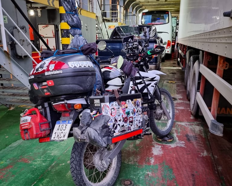 a motorcycle parked in a garage with a lot of luggage