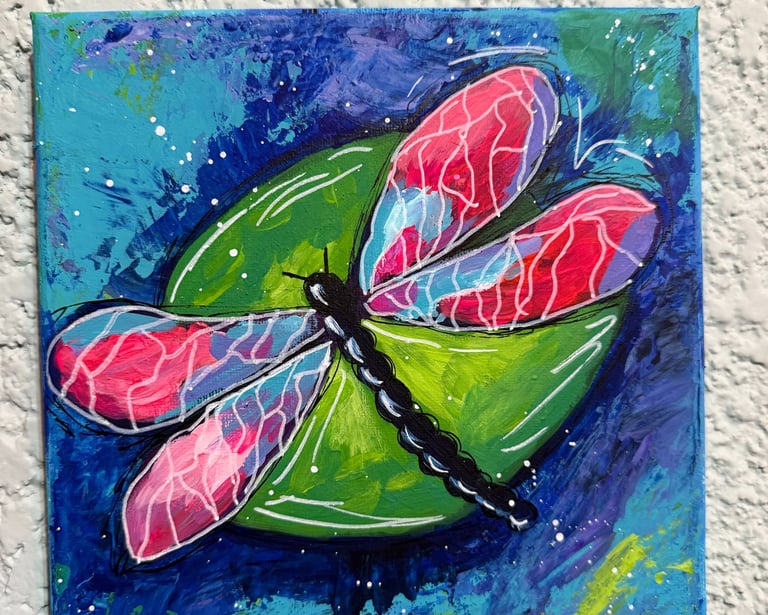 a painting of a dragonfly on a canvas
