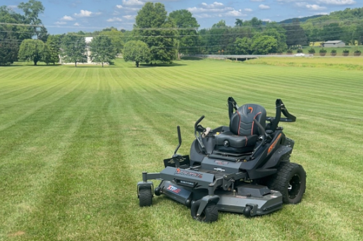 mower at idle with cut grass in background