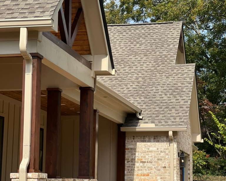 Seamless one-piece aluminum gutter installed on a residential roof.