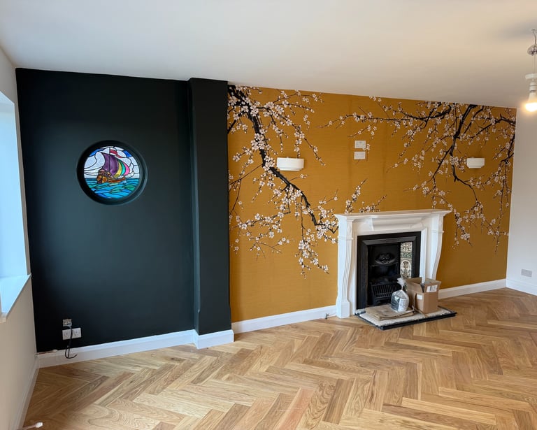 Wallpaper installation in a Brighton living room with fireplace