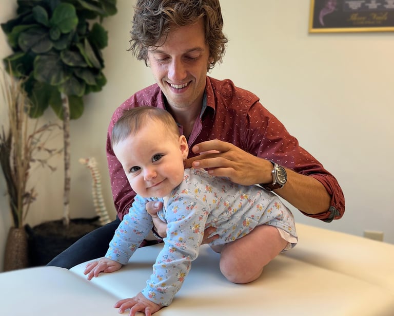 Young baby gettting a specific adjustment to the vagus nerve to help her calm and regulate