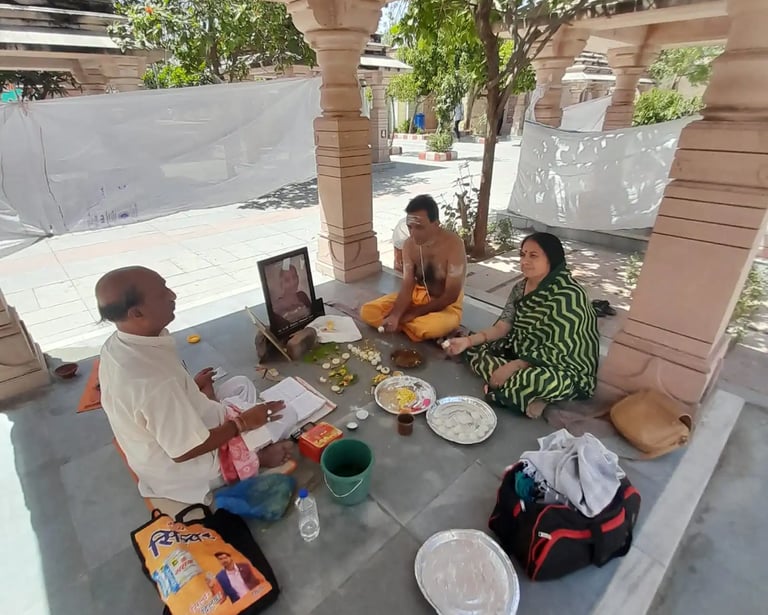 Yajaman couple performing Matrugaya Shraddh Pooja with departed mother's photograph at Bindu Sarovar Siddhpur