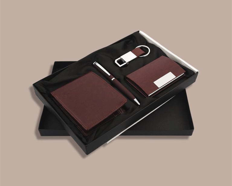 Executive onboarding new joinee kit including a cardholder, wallet, pen, and keychain.