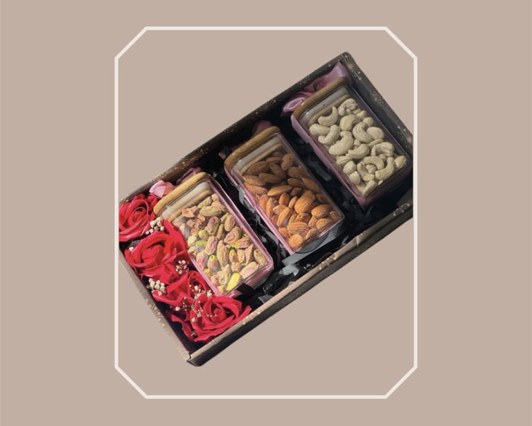 Elegant box gourmet food hamper featuring premium nuts and rose petals.