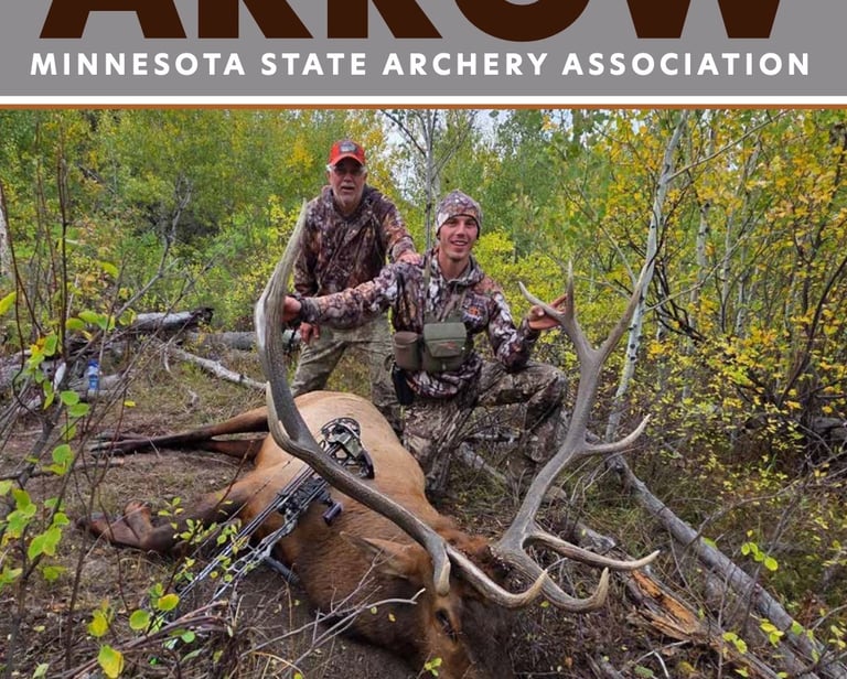 Bo Holand and his father posing with his harvested elk