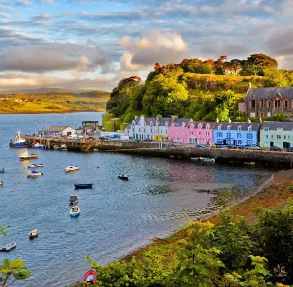 an aerial view of Portree on Skye surrounded by the water