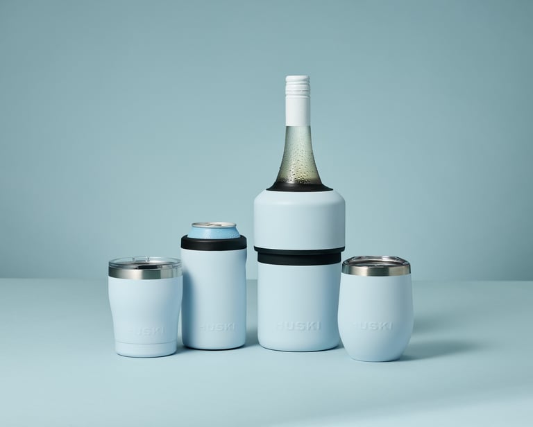 Product photography - A bottle of wine and a can inside two Huski coolers
