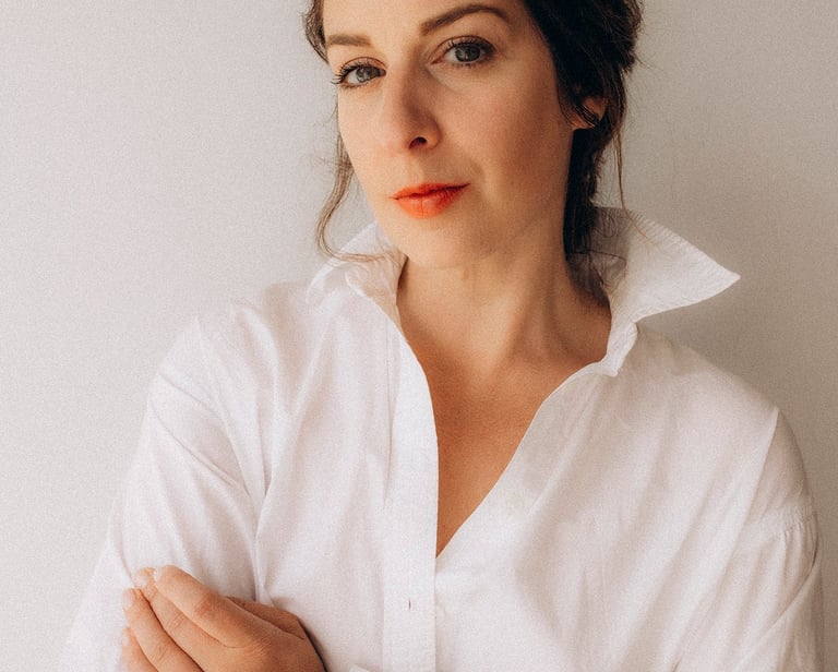 a woman in a white shirt and red lipstick