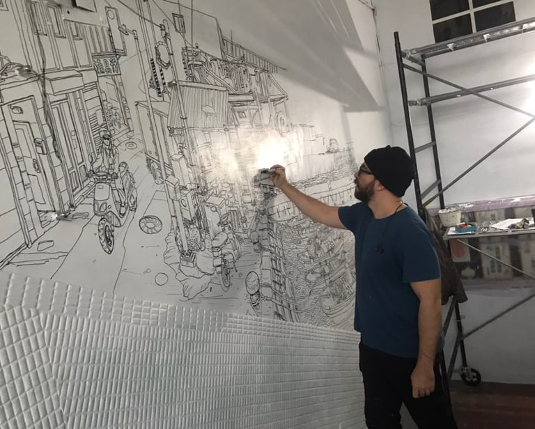 artist Evgeny Bondarenko sketching mural in Taiwan school