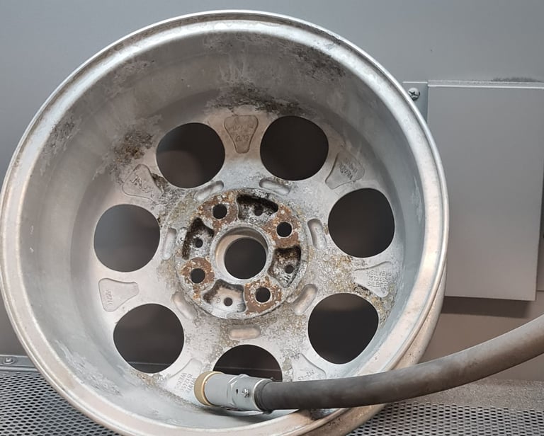 a tire with a hose attached to a tire