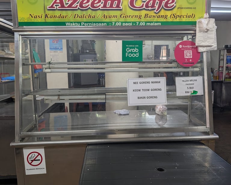Azeem Cafe food stall in Malaysia serving Nasi Kandar and Ayam Goreng Bawang.
