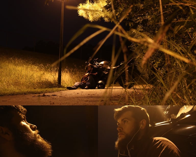 Adrien, a man with a beard and a motorcycle