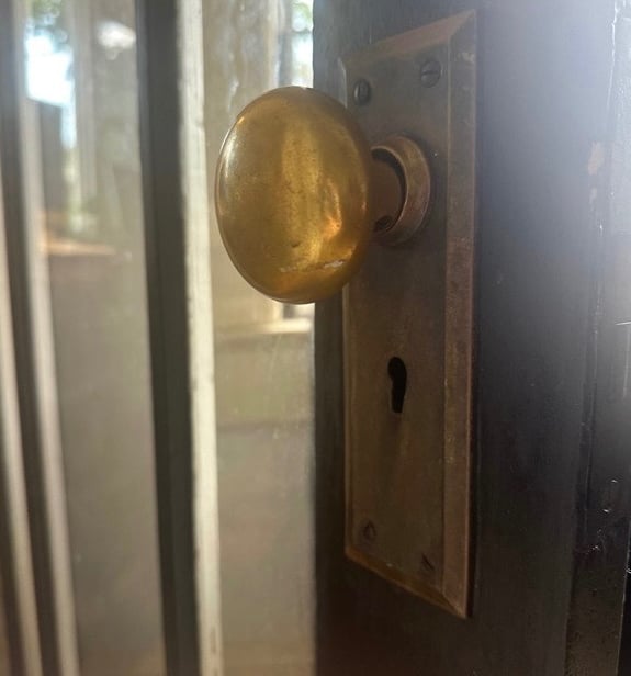 Chrome doorknob & keyhole representing residential locksmith services for key duplication & rekeying in Arden, NC